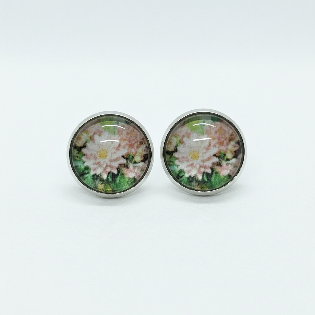 Pink floral stud earrings on white background