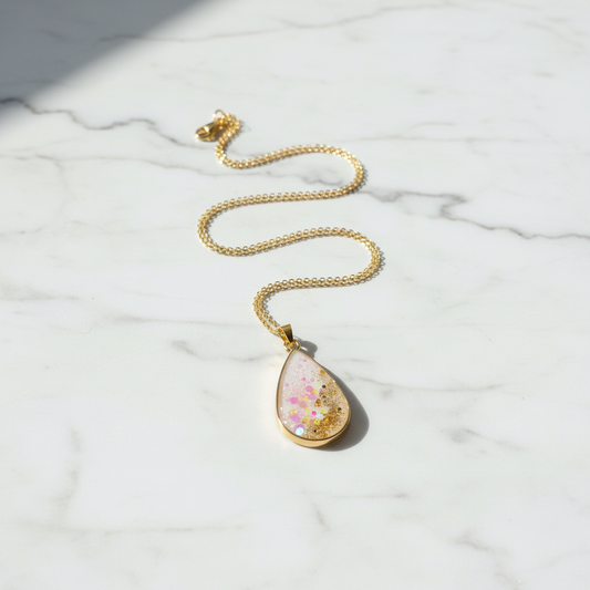 Professional product shot of pink pendant on marble