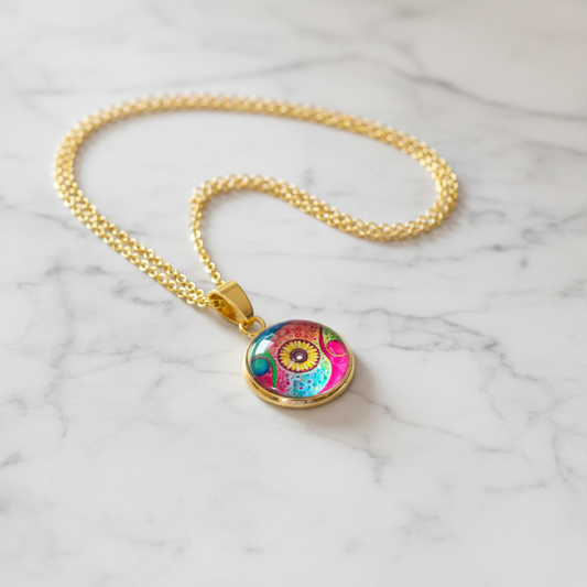 Abstract watercolor sunflower petite pendant necklace on white marble surface