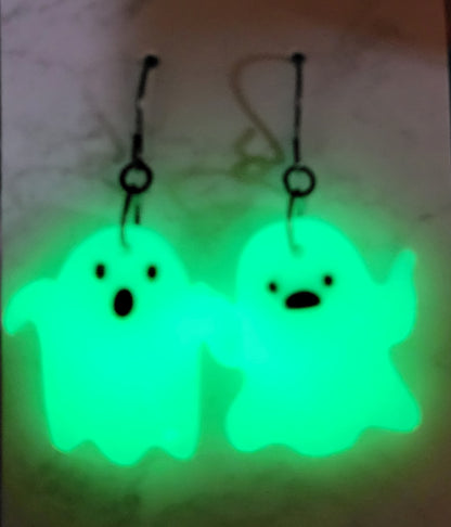 Mismatched ghost glow in the dark resin earrings glowing vivid neon green in the dark
