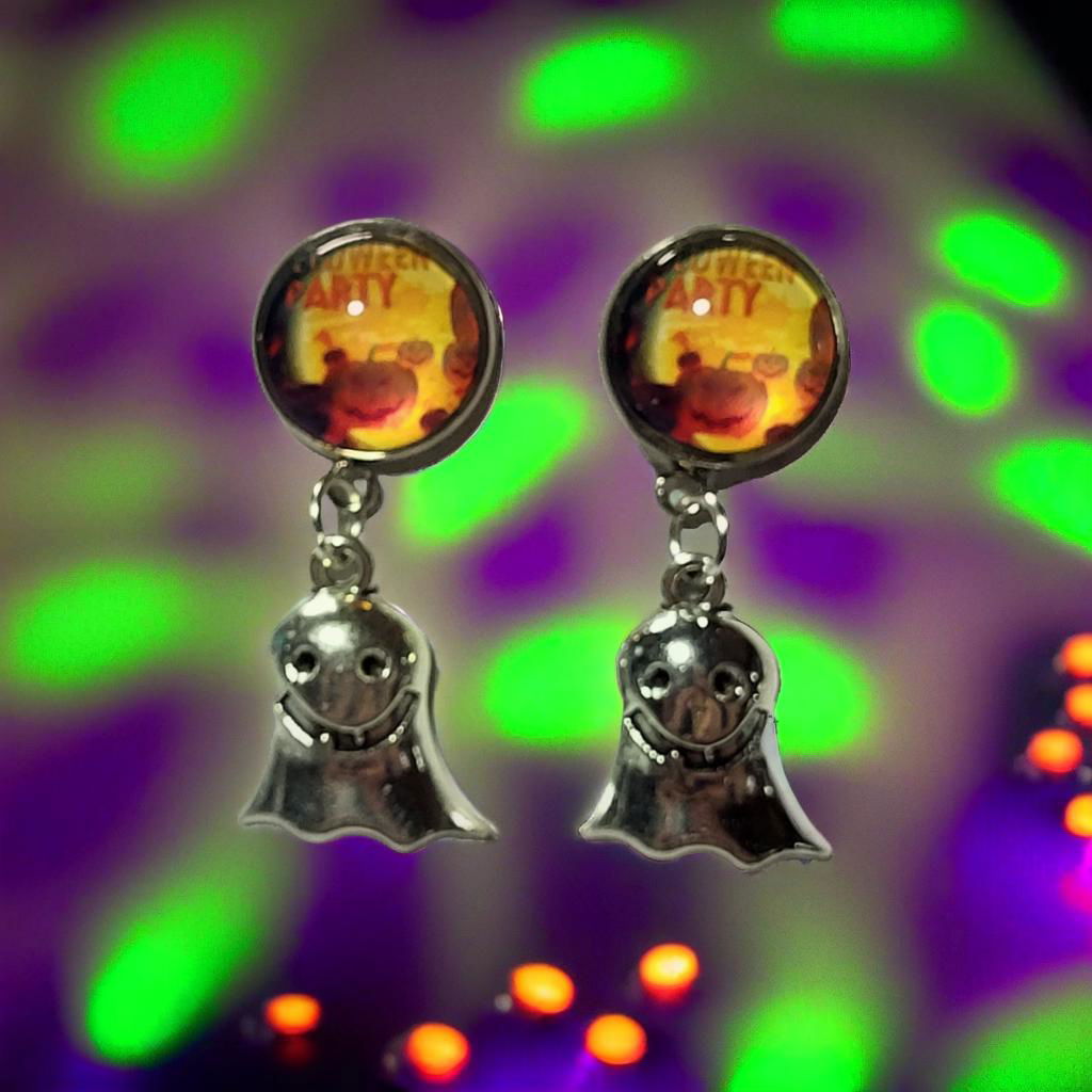 Halloween party cab smiling ghost charm drop earrings styled against green and purple Halloween party light background