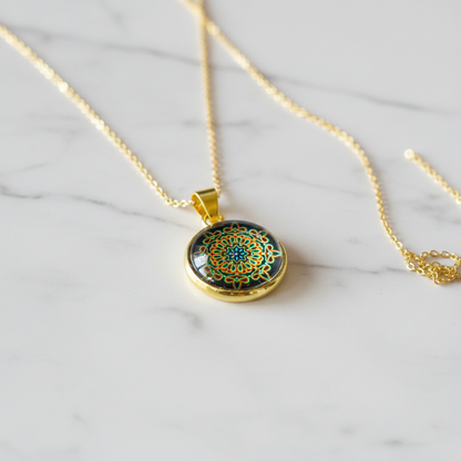 Psychedelic mandala petite pendant necklace on white marble surface