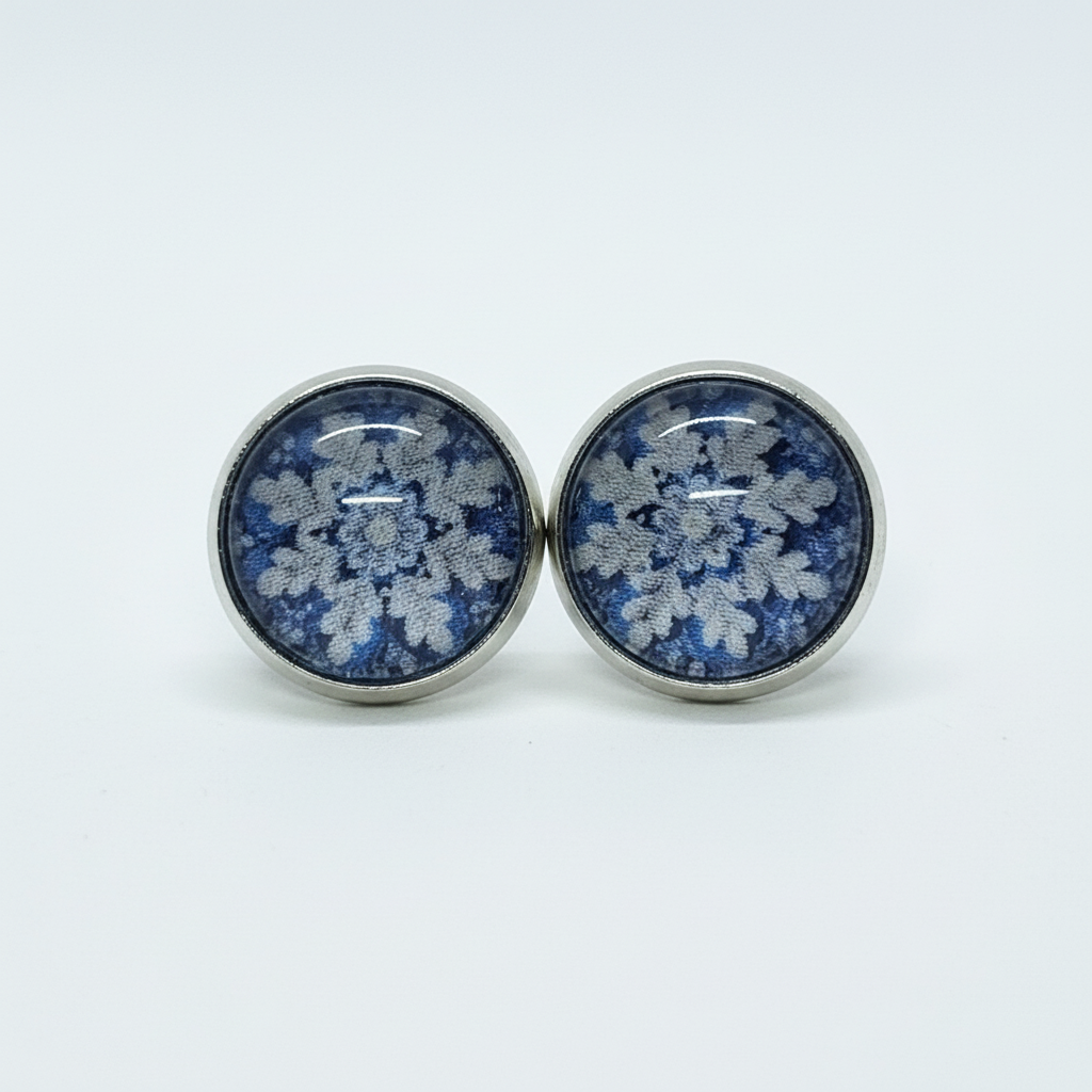 Blue floral lace stud earrings on white background