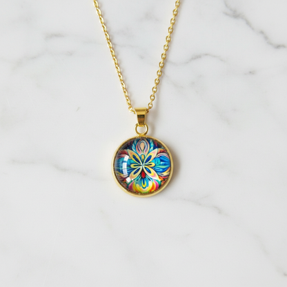 Vibrant pansy flower petite pendant necklace on white marble surface