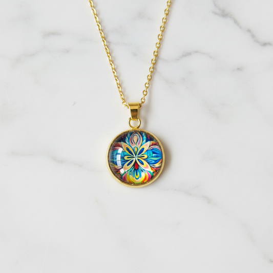 Vibrant pansy flower petite pendant necklace on white marble surface