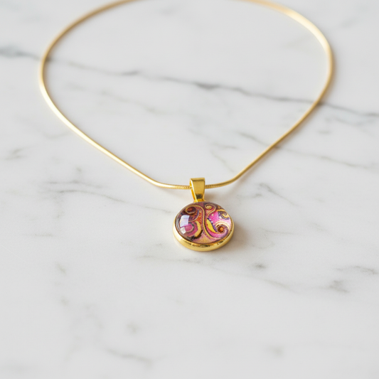 Abstract swirl art petite pendant necklace on white marble surface