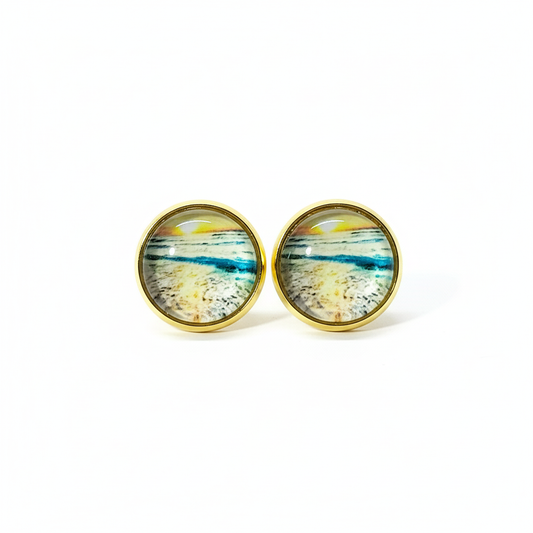 Beach scene stud earrings on white background