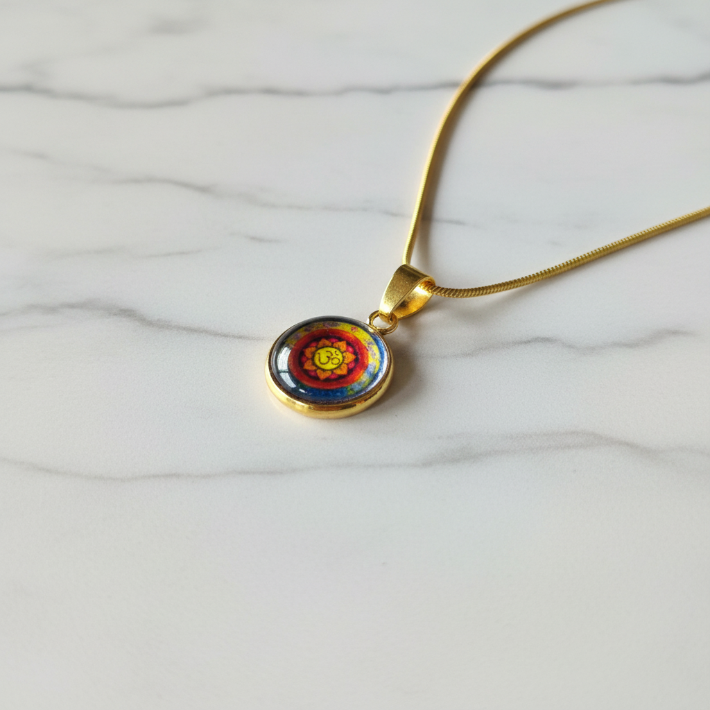 Om mandala petite pendant necklace angled view on marble surface