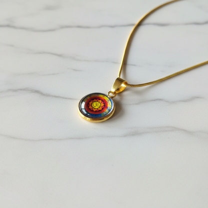 Om mandala petite pendant necklace angled view on marble surface