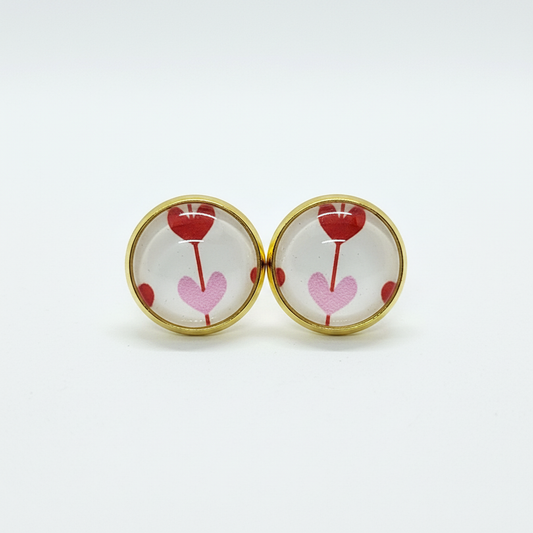 Heart balloon stud earrings on white background