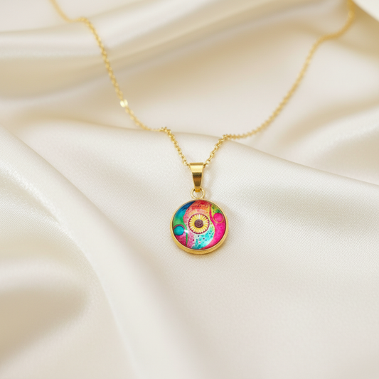 Close-up of glass dome cabochon abstract watercolor sunflower pendant on satin