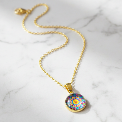 Kaleidoscope mandala petite pendant necklace on white marble surface