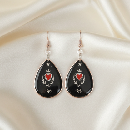 Sacred Heart Resin Earrings - front view on silk