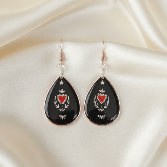 Sacred Heart Resin Earrings - front view on silk