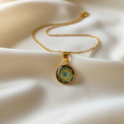 Close-up of glass dome cabochon psychedelic mandala pendant on satin
