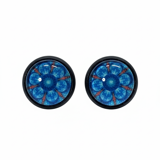 Octopus mandala stud earrings with blue tentacles and coral accents in black bezels