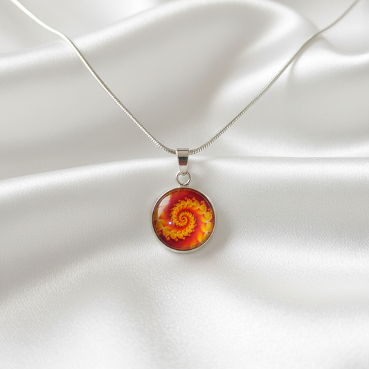 Orange yellow spiral fractal petite pendant necklace hero shot on white satin
