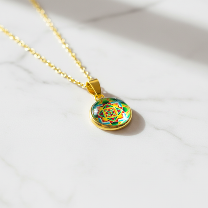 Sacred geometry mandala petite pendant necklace on white marble surface