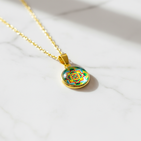 Sacred geometry mandala petite pendant necklace on white marble surface