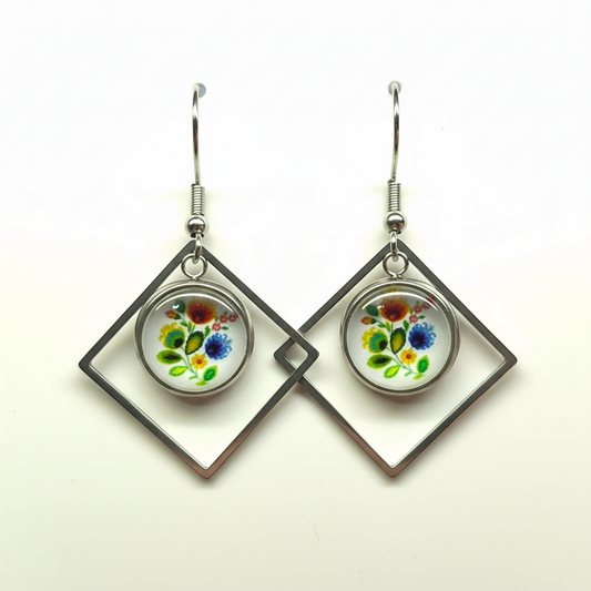 Silver dangle earrings with hand-painted watercolor floral medallions in diamond frames