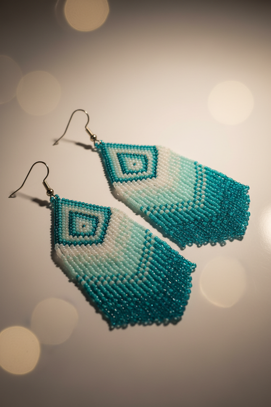 Teal and white ombre beaded fringe earrings, angled detail showing texture and movement