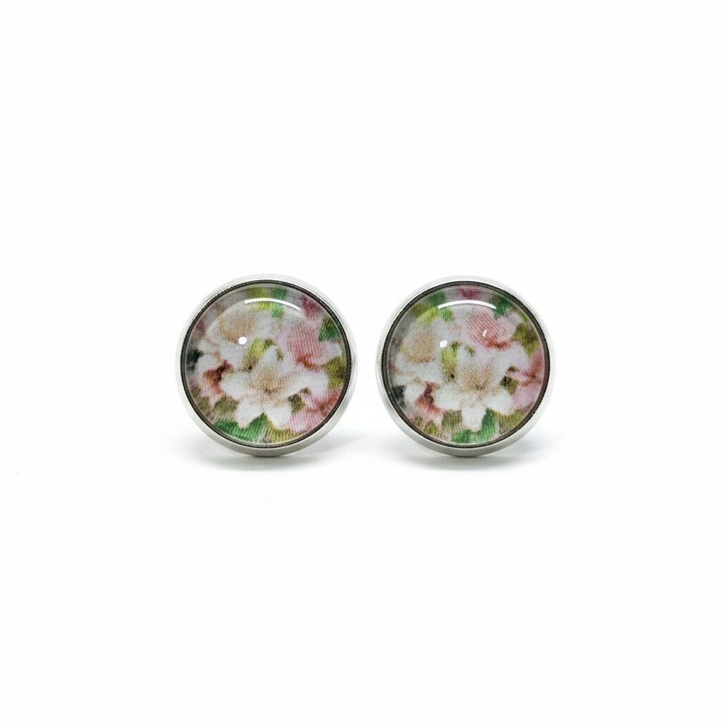 Pink and white floral stud earrings on white background