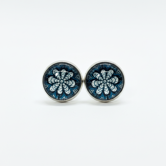 Teal mandala pattern stud earrings on white background
