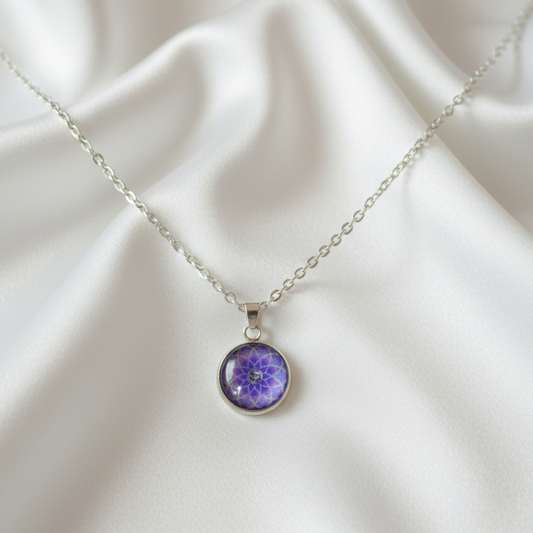 Purple Om mandala petite pendant necklace hero shot on white satin