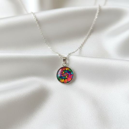 Rainbow kaleidoscope mandala petite pendant necklace hero shot on white satin